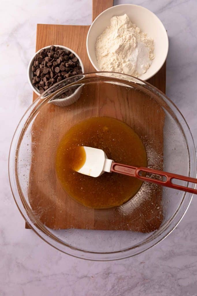 Mixing the wet ingredients for dough for one bowl chocolate chip cookies.