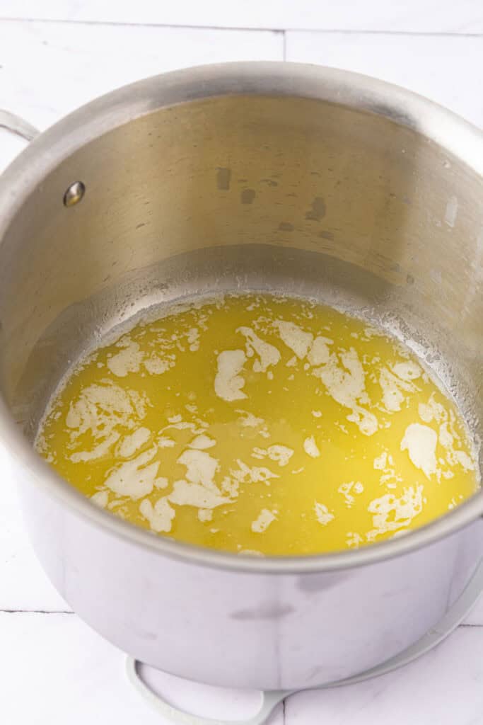 Melting butter to make rice krispies with lucky charms.